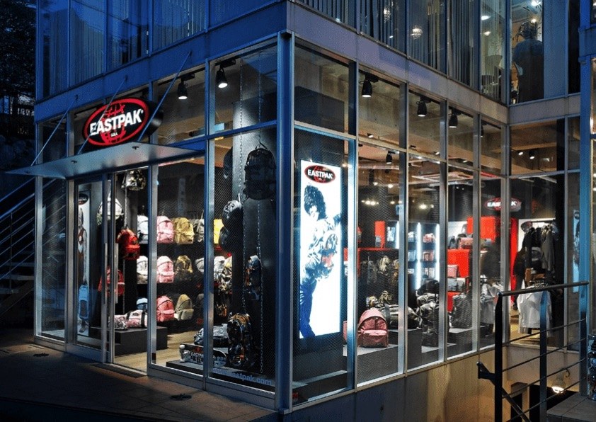 Eastpak flagship style store exterior at night